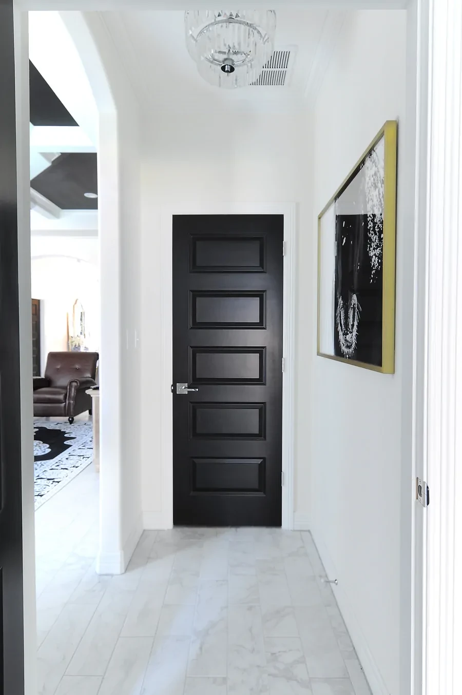 black doors with alabaster walls 