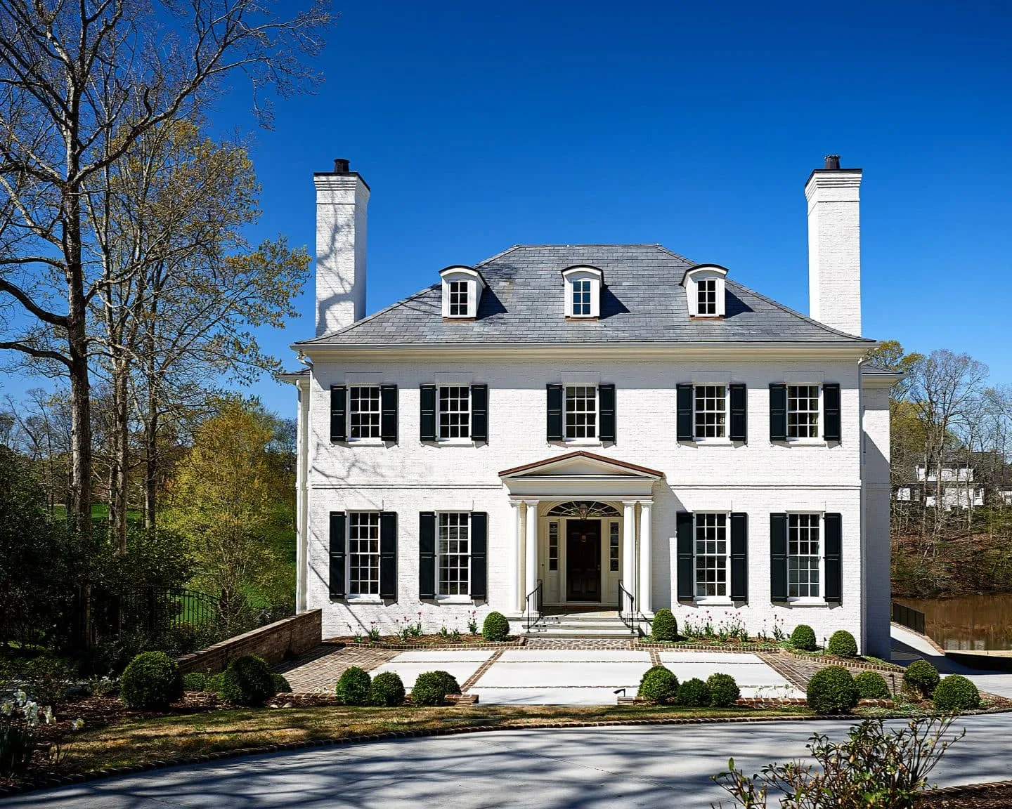 We Painted Our Trim White - white house black shutters